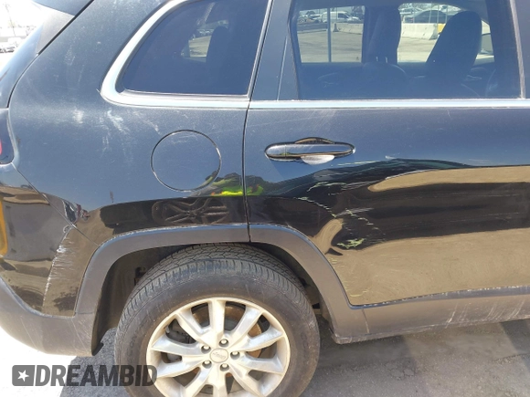 2014 Jeep Cherokee Limited with VIN 1C4PJMDB9EW210180, listed as a IAAI auction lot 41302037 with 75,177 mi miles and . Bid and sale history available at DreamBid. Image 6.