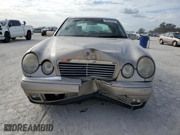 1999 Mercedes-Benz E-Class with VIN WDBJF82H9XX022535, listed as a Copart auction lot 86554534 with 140,904 mi miles and Salvage Title. Bid and sale history available at carsss.com. Image 5.