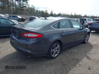 2015 Ford Fusion Energi Titanium with VIN 3FA6P0SU0FR200963, listed as a IAAI auction lot 41897182 with 104,100 mi miles. Bid and sale history available at carsss.com. Image 4.