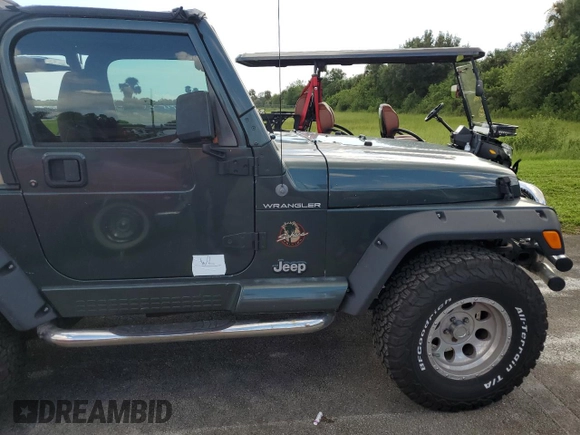 2002 Jeep Wrangler Sahara with VIN 1J4FA59S12P766719, listed as a Copart auction lot 74331964 with 128,881 mi miles and Non Repairable. Bid and sale history available at carsss.com. Image 13.
