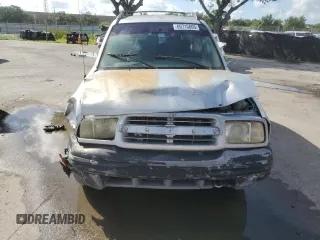 2003 Chevrolet Tracker with VIN 2CNBE13C836953178, listed as a Copart auction lot 60715605 with 128,978 mi miles and Salvage title. Bid and sale history available at DreamBid. Image 5.