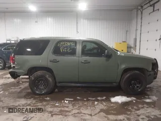 2014 Chevrolet Tahoe Commercial with VIN 1GNSK2E05ER196941, listed as a IAAI auction lot 41938892 with 176,170 mi miles and . Bid and sale history available at DreamBid. Image 14.