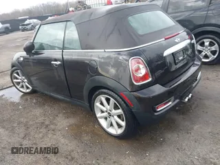 2013 MINI Convertible S with VIN WMWZP3C54DT297304, listed as a IAAI auction lot 41377572 with 101,991 mi miles and . Bid and sale history available at DreamBid. Image 3.