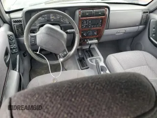 1997 Jeep Cherokee Country with VIN 1J4FJ78S4VL589852, listed as a Copart auction lot 56294015 with 189,530 mi miles and Salvage title. Bid and sale history available at DreamBid. Image 8.