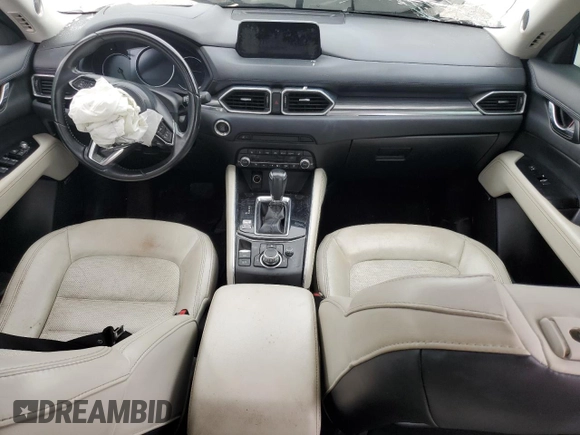2019 Mazda CX-5 Grand Touring with VIN JM3KFADM6K1581261, listed as a Copart auction lot 59965175 with 127,837 mi miles and Salvage title. Bid and sale history available at DreamBid. Image 8.