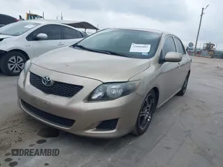 2009 Toyota Corolla with VIN 1NXBU40E99Z118081, listed as a IAAI auction lot 42086882 with 199,328 mi miles and . Bid and sale history available at DreamBid. Image 2.