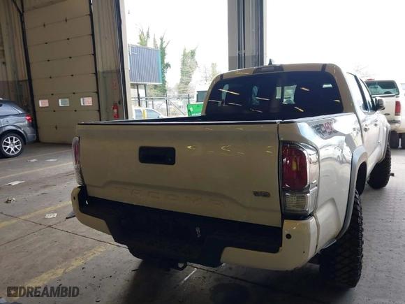 2020 Toyota Tacoma 4WD SR5 with VIN 5TFCZ5AN6LX235847, listed as a IAAI auction lot 41676928 with 77,384 mi miles. Bid and sale history available at carsss.com. Image 16.