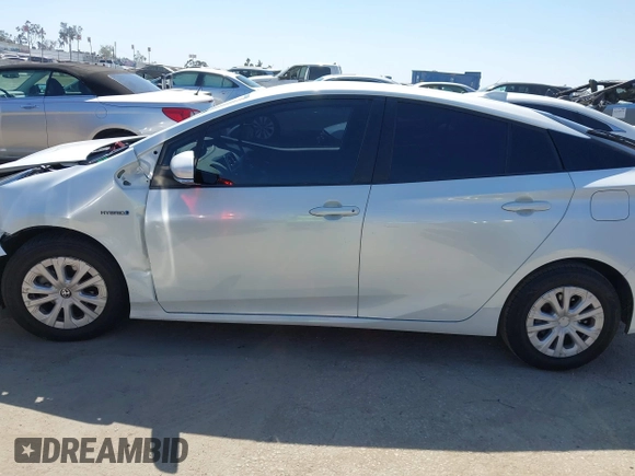 2021 Toyota Prius L Eco with VIN JTDKAMFU8M3135142, listed as a IAAI auction lot 42317007 with 77,353 mi miles and . Bid and sale history available at DreamBid. Image 14.