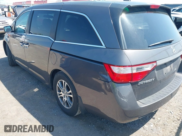 2013 Honda Odyssey EX-L with VIN 5FNRL5H65DB011071, listed as a IAAI auction lot 41992265 with 192,624 mi miles and . Bid and sale history available at DreamBid. Image 3.