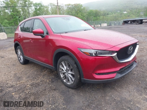 2020 Mazda CX-5 Grand Touring with VIN JM3KFBDM7L1731837, listed as a IAAI auction lot 42160795 with 63,826 mi miles and . Bid and sale history available at DreamBid. Image 1.