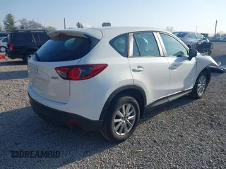 2016 Mazda CX-5 Sport with VIN JM3KE2BY2G0819604, listed as a IAAI auction lot 42059846 with 124,911 mi miles. Bid and sale history available at carsss.com. Image 4.