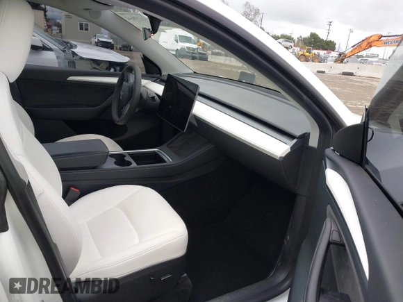 2023 Tesla Model Y Long Range with VIN 7SAYGDEE1PA106057, listed as a IAAI auction lot 41778642 with 1 mi miles. Bid and sale history available at carsss.com. Image 5.