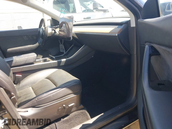 2020 Tesla Model Y Long Range with VIN 5YJYGDEE2LF059177, listed as a IAAI auction lot 41916260 with 66,190 mi miles and . Bid and sale history available at DreamBid. Image 5.
