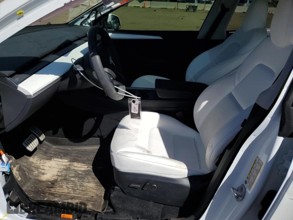 2024 Tesla Model Y Performance with VIN 7SAYGDEF6RA284171, listed as a Copart auction lot 50317205 with 6,870 mi miles and Salvage Title. Bid and sale history available at DreamBid. Image 7.