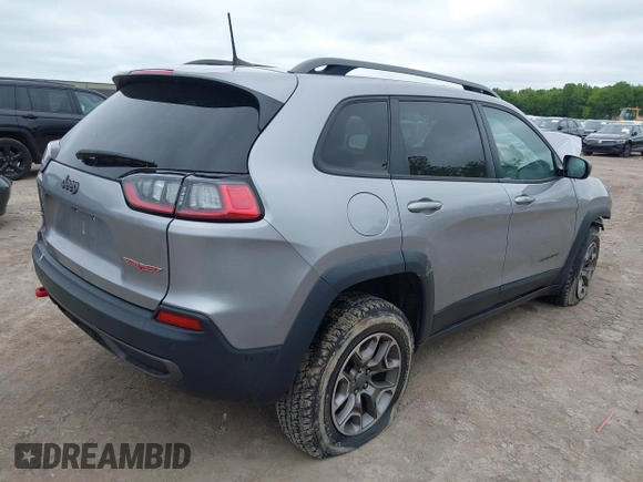 2020 Jeep Cherokee Trailhawk z VIN 1C4PJMBX0LD588251, wystawiony jako IAAI lot #42310054 z przebiegiem 47 780 mil mil oraz . Historia ofert i sprzedaży dostępna na DreamBid. Obrazek 4.