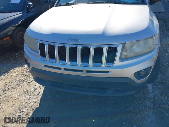 2011 Jeep Compass with VIN 1J4NT1FB8BD248904, listed as a IAAI auction lot 41667133 with 212,887 mi miles. Bid and sale history available at carsss.com. Image 6.