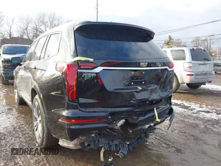 2025 Cadillac XT6 FWD Premium Luxury with VIN 1GYKPCRS6SZ104902, listed as a IAAI auction lot 41565224 with 4,735 mi miles. Bid and sale history available at carsss.com. Image 6.