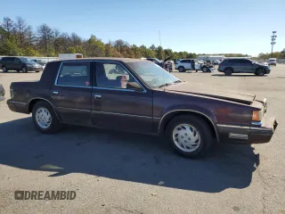 1989 Dodge Dynasty z VIN 1B3BC4637KD532206, wystawiony jako Copart lot #74233744 z przebiegiem 85 245 mil mil oraz Czysty tytuł • Clean title. Historia ofert i sprzedaży dostępna na DreamBid. Obrazek 4.