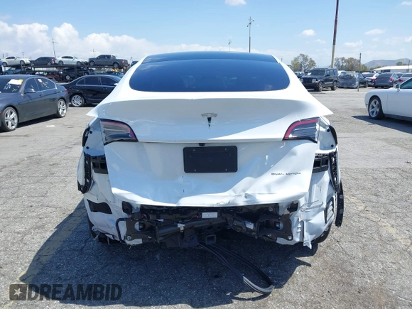 2023 Tesla Model Y Long Range with VIN 7SAYGAEE5PF855834, listed as a IAAI auction lot 41943491 with 34,480 mi miles. Bid and sale history available at carsss.com. Image 17.