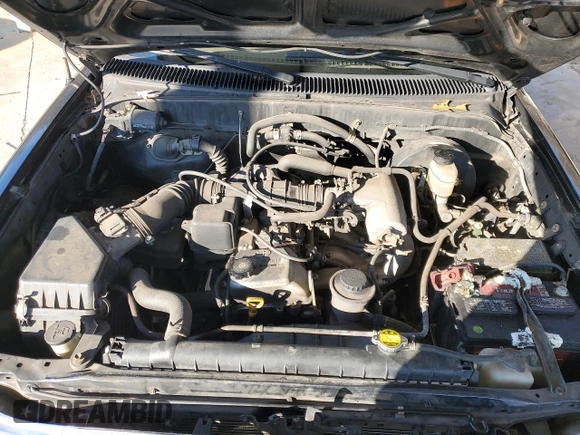 2002 Toyota Tacoma z VIN 5TEVL52N72Z135028, wystawiony jako Copart lot #41471305 z przebiegiem 255 891 mil mil oraz Szkoda całkowita • Salvage title. Historia ofert i sprzedaży dostępna na DreamBid. Obrazek 13.