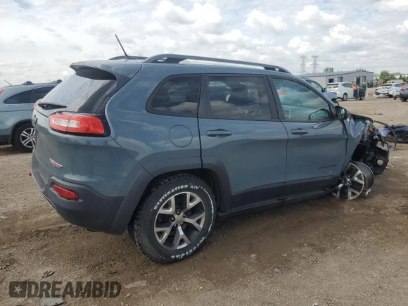 2015 Jeep Cherokee Trailhawk with VIN 1C4PJMBB1FW630715, listed as a Copart auction lot 58559675 with 58,302 mi miles and Salvage title. Bid and sale history available at DreamBid. Image 3.