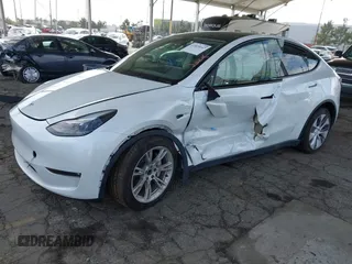 2023 Tesla Model Y Long Range with VIN 7SAYGAEE7PF607195, listed as a IAAI auction lot 41819147 with 74,694 mi miles. Bid and sale history available at carsss.com. Image 17.