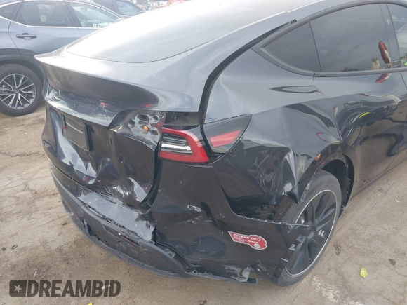 2024 Tesla Model Y with VIN 7SAYGDED8RF116209, listed as a IAAI auction lot 41761804 with 12,048 mi miles and . Bid and sale history available at DreamBid. Image 6.