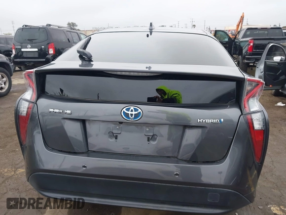 2018 Toyota Prius Two with VIN JTDKBRFUXJ3591956, listed as a IAAI auction lot 41848336 with 62,560 mi miles and . Bid and sale history available at DreamBid. Image 16.