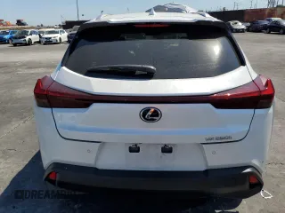 2024 Lexus UX with VIN JTHX6JBH7R2189588, listed as a Copart auction lot 70237664 with 9,963 mi miles and Salvage Title. Bid and sale history available at carsss.com. Image 6.