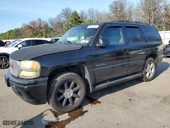 2004 GMC Yukon Denali with VIN 1GKEK63U74J212674, listed as a Copart auction lot 69704734 with 174,893 mi miles and Salvage Title. Bid and sale history available at carsss.com. Image 1.