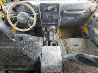 2009 Jeep Wrangler X with VIN 1J4FA24119L754391, listed as a Copart auction lot 56067805 with 118,117 mi miles and Salvage title. Bid and sale history available at DreamBid. Image 8.