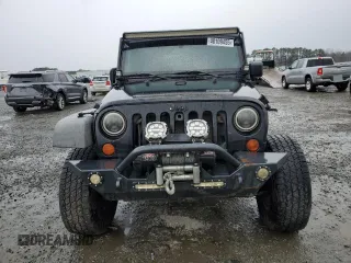 2009 Jeep Wrangler X with VIN 1J4FA241X9L735743, listed as a Copart auction lot 48109455 with 232,110 mi miles and Salvage Title. Bid and sale history available at DreamBid. Image 5.