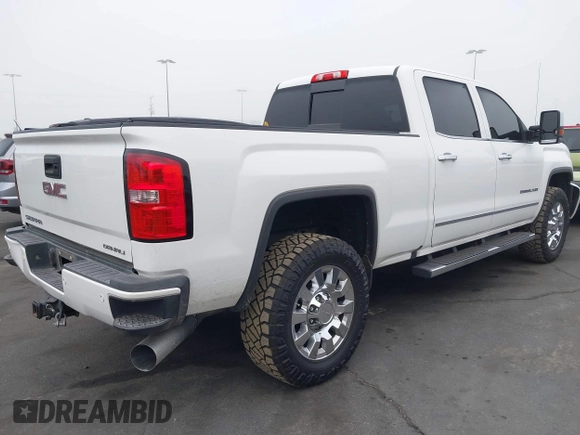 2015 GMC Sierra 2500HD Denali with VIN 1GT120E85FF681680, listed as a IAAI auction lot 42081711 with 67,676 mi miles and . Bid and sale history available at DreamBid. Image 4.