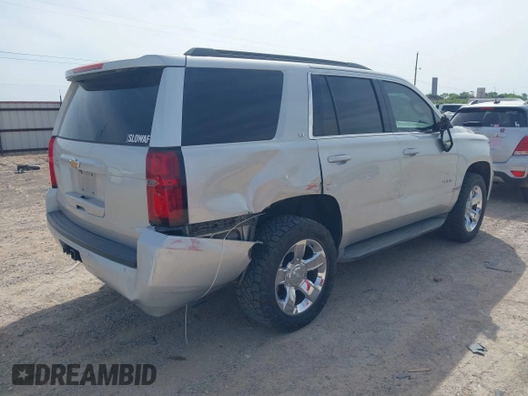 2015 Chevrolet Tahoe LT with VIN 1GNSCBKC9FR111984, listed as a IAAI auction lot 42003685 with 186,391 mi miles and . Bid and sale history available at DreamBid. Image 4.