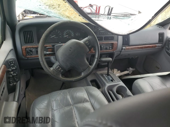 1997 Jeep Grand Cherokee Limited with VIN 1J4GX78YXVC716353, listed as a Copart auction lot 85207974 with 115,527 mi miles and Salvage Title. Bid and sale history available at carsss.com. Image 8.