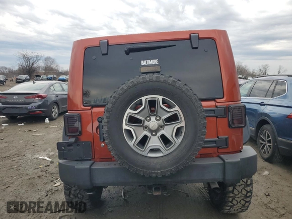 2014 Jeep Wrangler Unlimited Rubicon with VIN 1C4BJWFG0EL187243, listed as a Copart auction lot 45865005 with 53,064 mi miles and Salvage title. Bid and sale history available at DreamBid. Image 6.