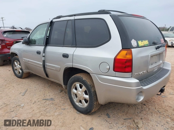 2005 GMC Envoy SLT with VIN 1GKDT13S452263166, listed as a IAAI auction lot 41543466 with 166,999 mi miles. Bid and sale history available at carsss.com. Image 3.