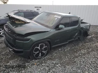 2024 Rivian R1T Adventure z VIN 7FCTGCAA1RN030829, wystawiony jako Copart lot #81459854 z przebiegiem Nie podano mil oraz Szkody całkowita. Historia ofert i sprzedaży dostępna na DreamBid. Obrazek 1.