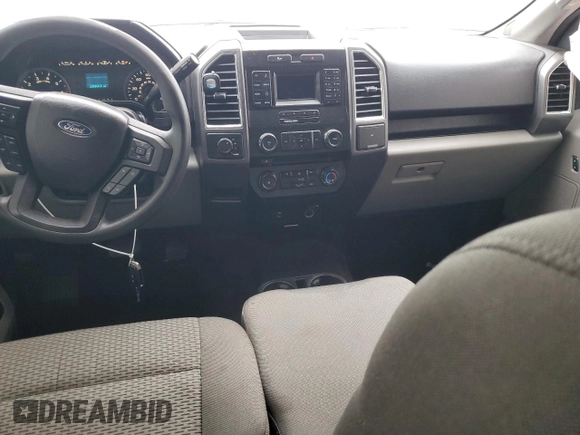 2016 Ford F-150 XLT with VIN 1FTEW1EG7GKD00973, listed as a Copart auction lot 56011785 with 128,344 mi miles and Salvage title. Bid and sale history available at DreamBid. Image 8.