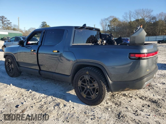 2023 Rivian R1T Adventure z VIN 7FCTGAAA1PN022134, wystawiony jako Copart lot #85545774 z przebiegiem 48 951 mil mil oraz Szkoda całkowita • Salvage title. Historia ofert i sprzedaży dostępna na DreamBid. Obrazek 2.