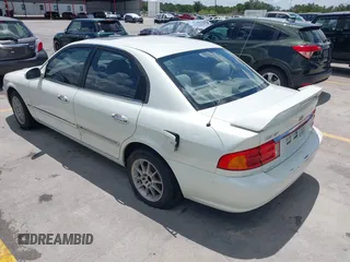 2002 Kia Optima LX z VIN KNAGD126325144218, wystawiony jako IAAI lot #42596691 z przebiegiem 220 972 mil mil oraz . Historia ofert i sprzedaży dostępna na DreamBid. Obrazek 3.