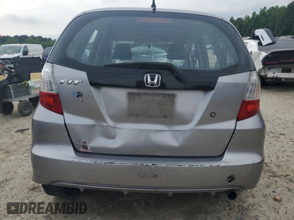 2009 Honda Fit with VIN JHMGE88249S025083, listed as a Copart auction lot 58121945 with Not provided miles and Salvage title. Bid and sale history available at DreamBid. Image 6.