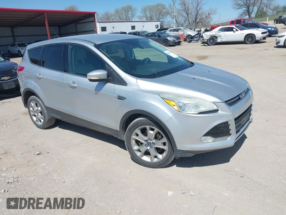 2013 Ford Escape SEL with VIN 1FMCU9H91DUA14749, listed as a IAAI auction lot 42039685 with 186,669 mi miles. Bid and sale history available at carsss.com. Image 1.