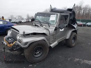 2001 Jeep Wrangler Sport with VIN 1J4FA49S41P355646, listed as a IAAI auction lot 41937746 with 160,634 mi miles. Bid and sale history available at carsss.com. Image 2.