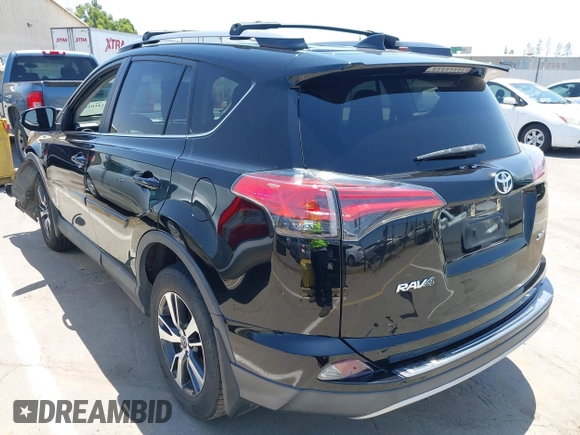 2018 Toyota RAV4 XLE with VIN 2T3WFREV2JW447623, listed as a IAAI auction lot 42410168 with 84,800 mi miles and . Bid and sale history available at DreamBid. Image 3.