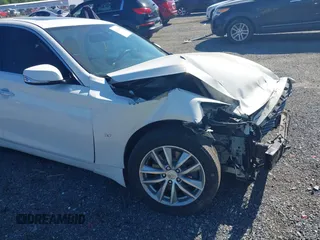 2015 Infiniti Q50 z VIN JN1BV7AR9FM413538, wystawiony jako IAAI lot #42115540 z przebiegiem 116 620 mil mil oraz . Historia ofert i sprzedaży dostępna na DreamBid. Obrazek 6.