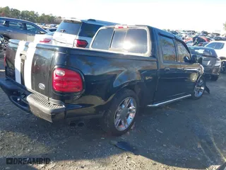 2001 Ford F-150 SuperCrew XLT with VIN 1FTRW07L11KB37184, listed as a IAAI auction lot 41077787 with 207,520 mi miles. Bid and sale history available at carsss.com. Image 4.