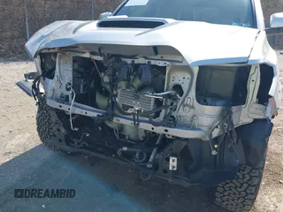 2020 Toyota Tacoma SR5 with VIN 3TMCZ5AN3LM320411, listed as a IAAI auction lot 41838498 with 50,252 mi miles and . Bid and sale history available at DreamBid. Image 6.