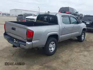 2018 Toyota Tacoma SR with VIN 3TMCZ5AN4JM130307, listed as a IAAI auction lot 41541477 with 74,369 mi miles and . Bid and sale history available at DreamBid. Image 4.