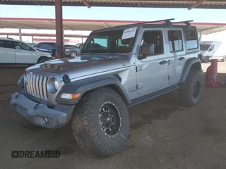 2019 Jeep Wrangler Unlimited Sport S z VIN 1C4HJXDG7KW557682, wystawiony jako IAAI lot #42586742 z przebiegiem 49 741 mil mil oraz . Historia ofert i sprzedaży dostępna na DreamBid. Obrazek 16.